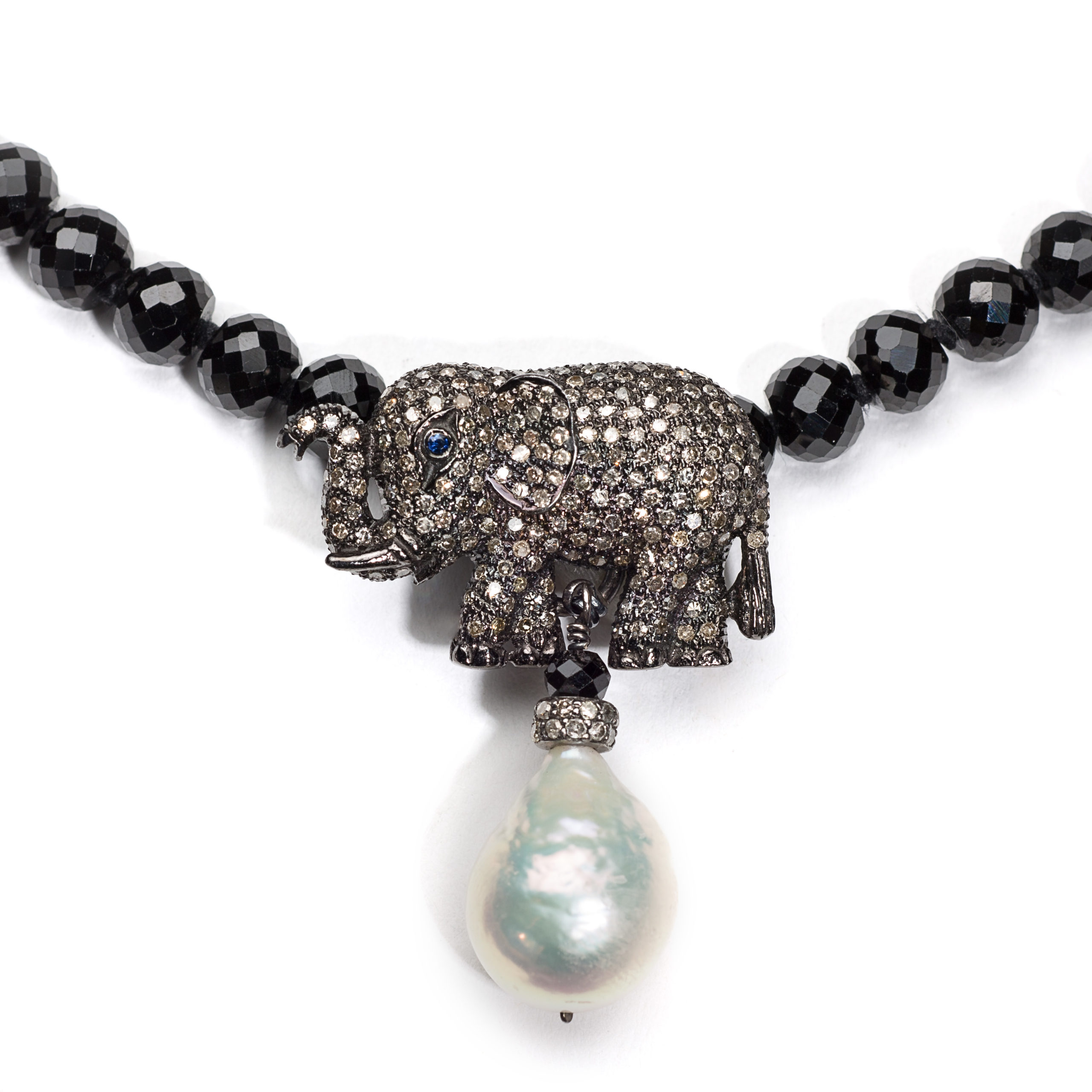 Pave diamond elephant and pearl pendant on necklace